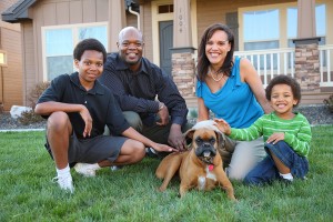 family in yard with dog