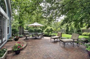 Brick patio with table umbrella and chairs