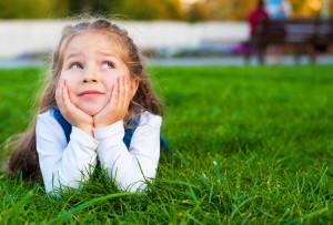 Little Girl Dreaming in the park