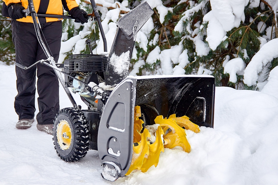 Commercial Landscape Management company clearing snow after a snow storm.