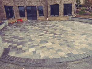 various dark neutral colors of brick paver patio