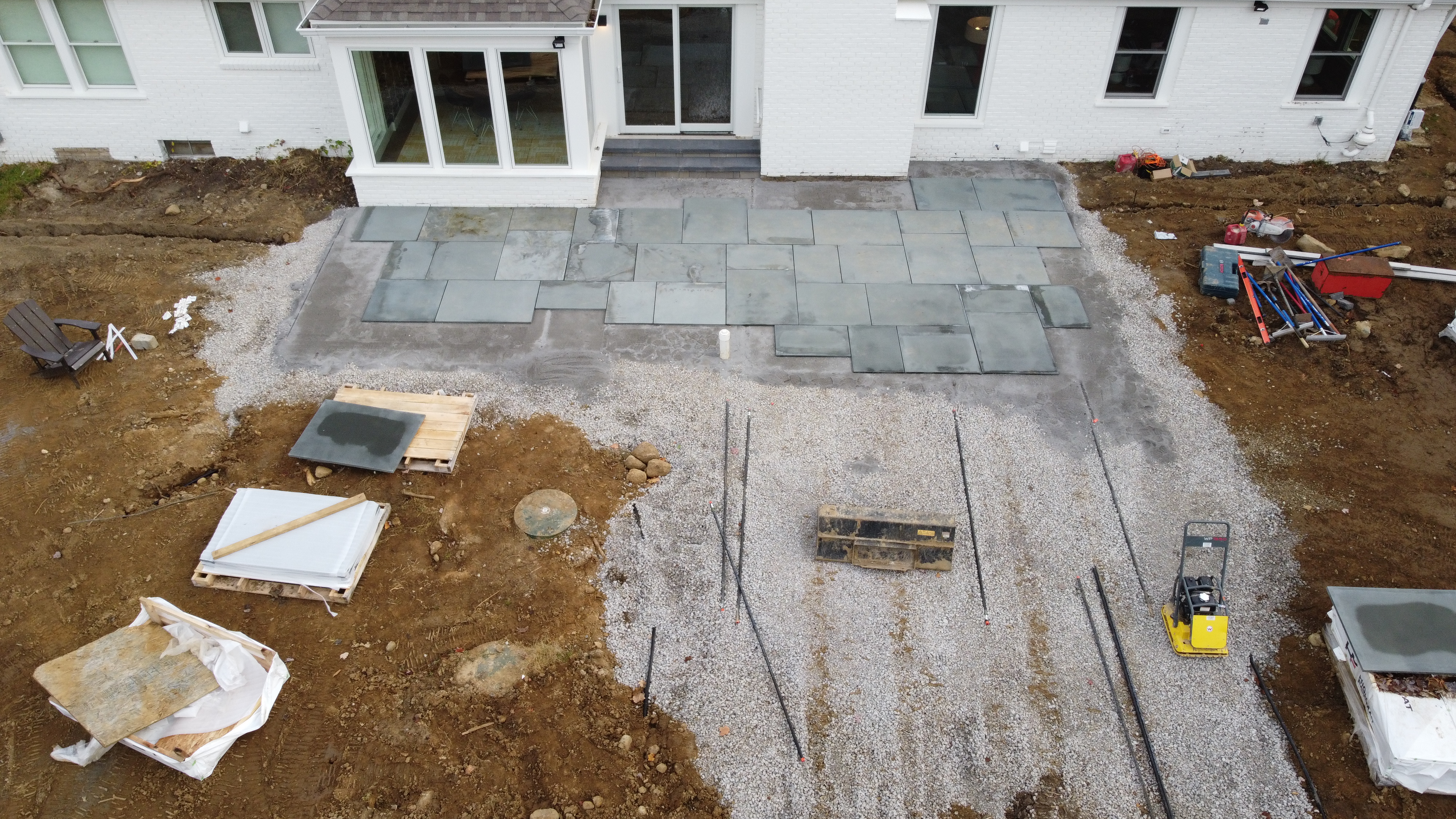 Work is underway for laying the pavers down for the patio.