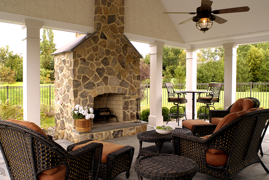 Beautiful outdoor living space with fireplace and vaulted ceiling.