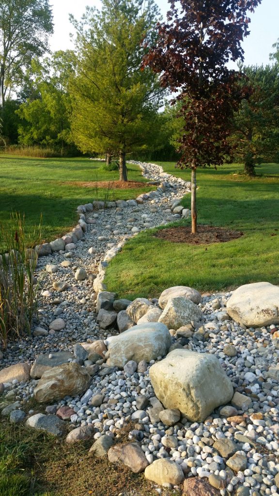 additional photos of a dry creek river bed in Ann arbor michigan created and installed by twin oaks landscape