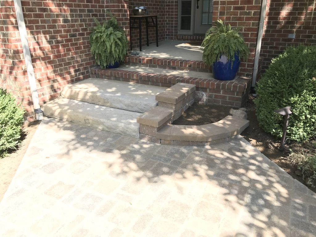 Steps off a walkway to a front porch in Ann Arbor