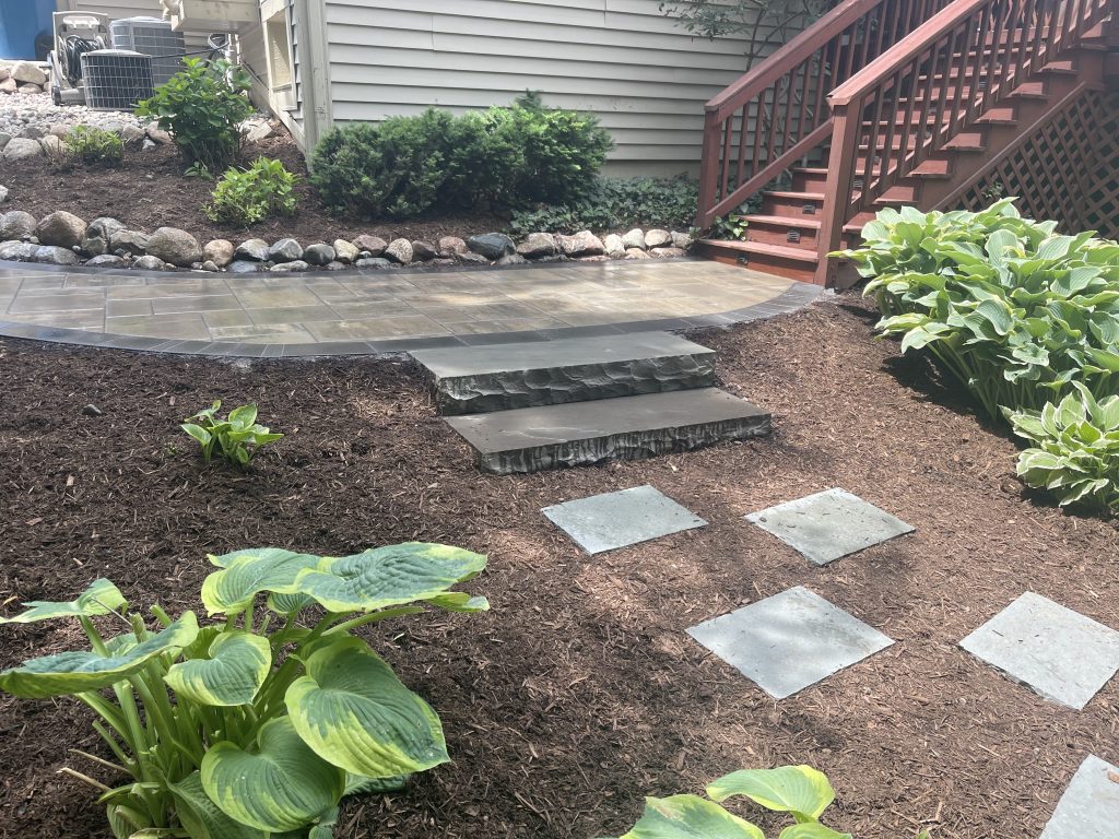 Steps off walkway to a stone path