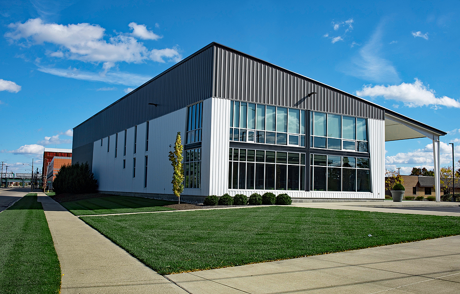 Modern office building with professionally landscaped outdoor property. 