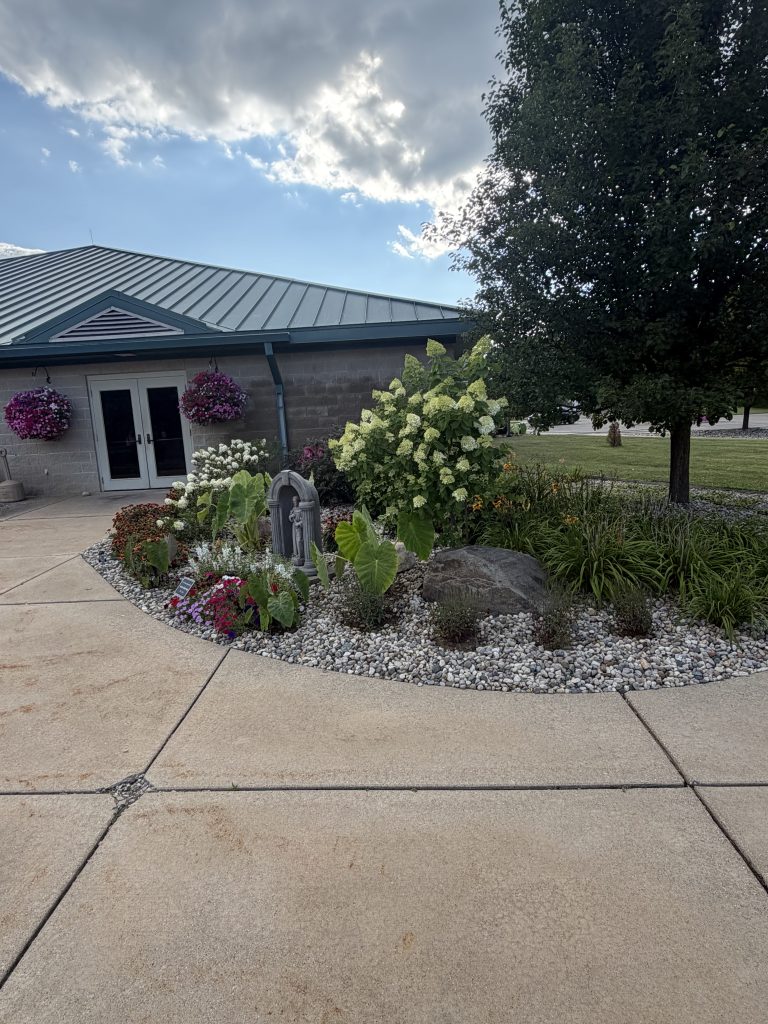 Stone Covered Flowerbed and Driveway Pavers