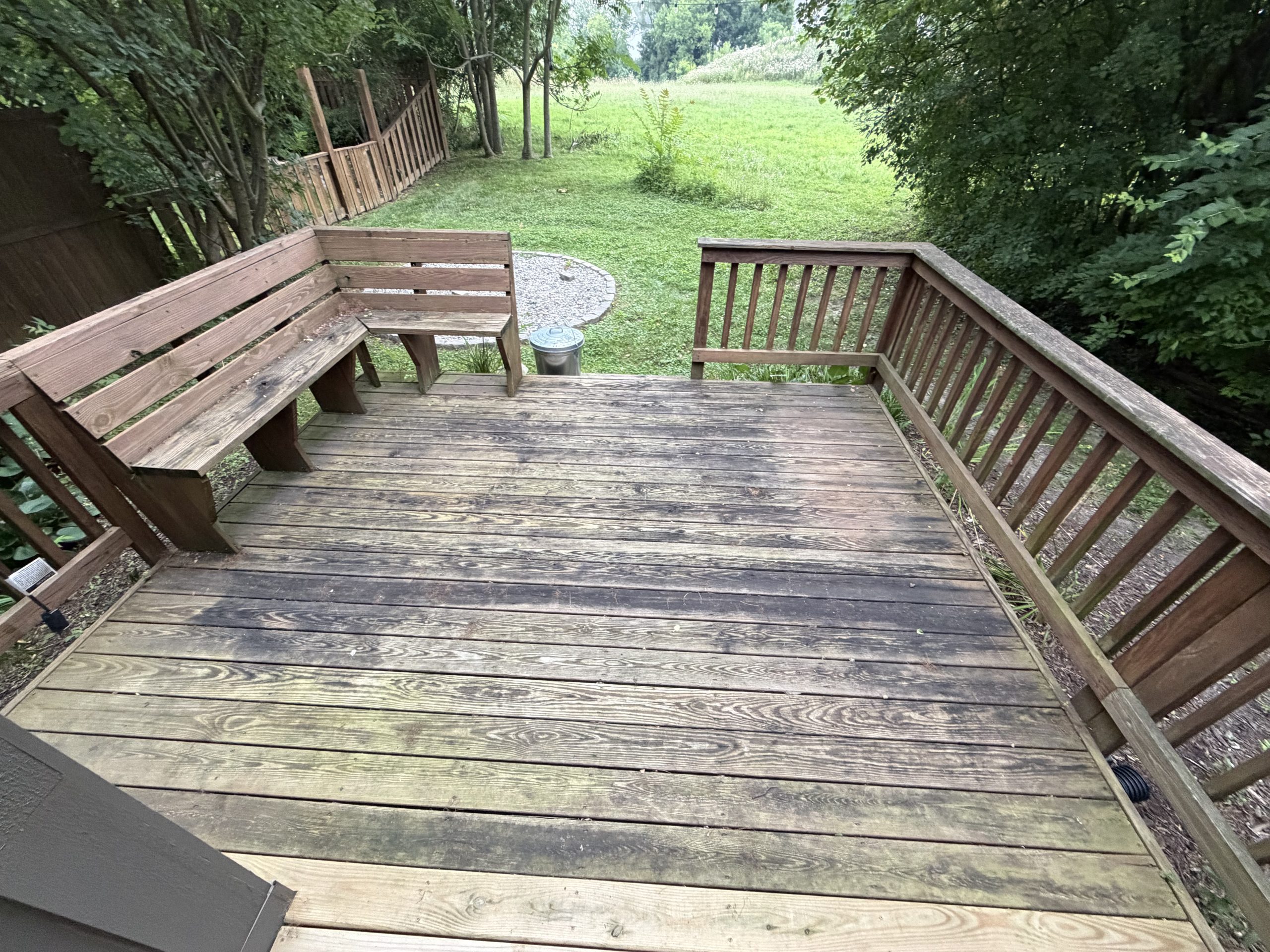 Closeup of an old wood deck with signs of water damage. 